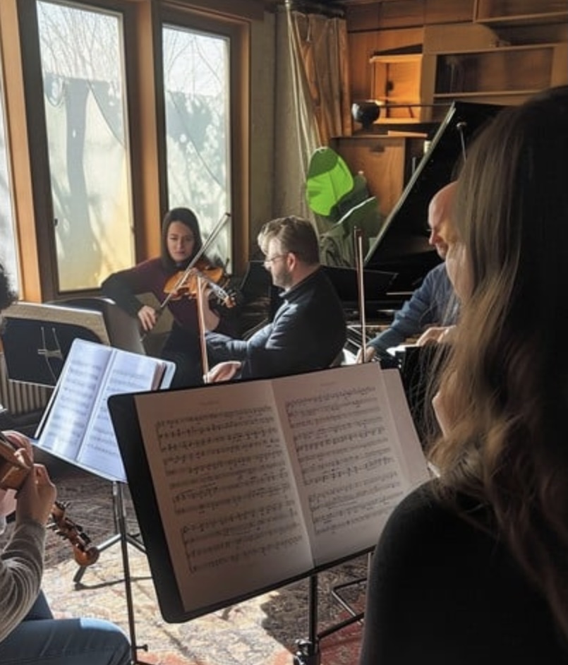 Five musicians playing chamber music.