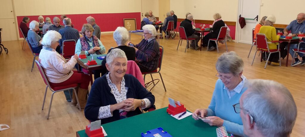 Groups of members enjoying a game of duplicate bridge.