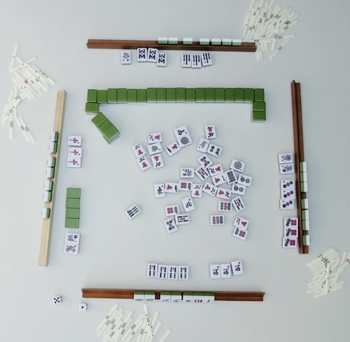The game of Mah Yong on a board laid out for four players.